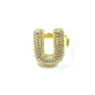Gold huggie hoop earring with clear gemstones on a white background