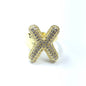 Gold ring with letter 'X' design on a white background