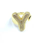 Gold ring with diamond-like stones on a white background