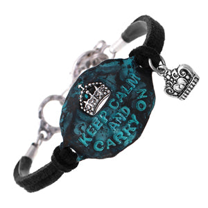 Teal keychain with motivational text and heart charm on a white background