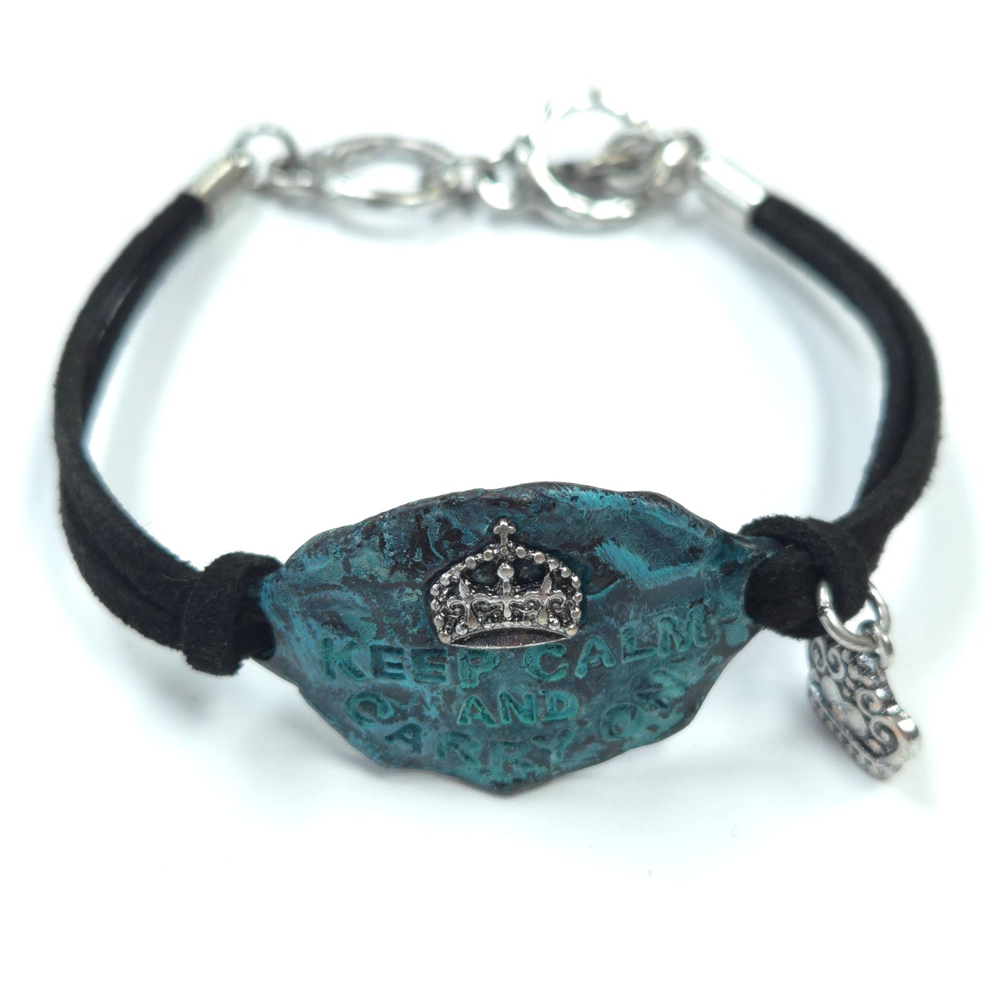 Bracelet with blue textured bead and silver crown charm on a white background