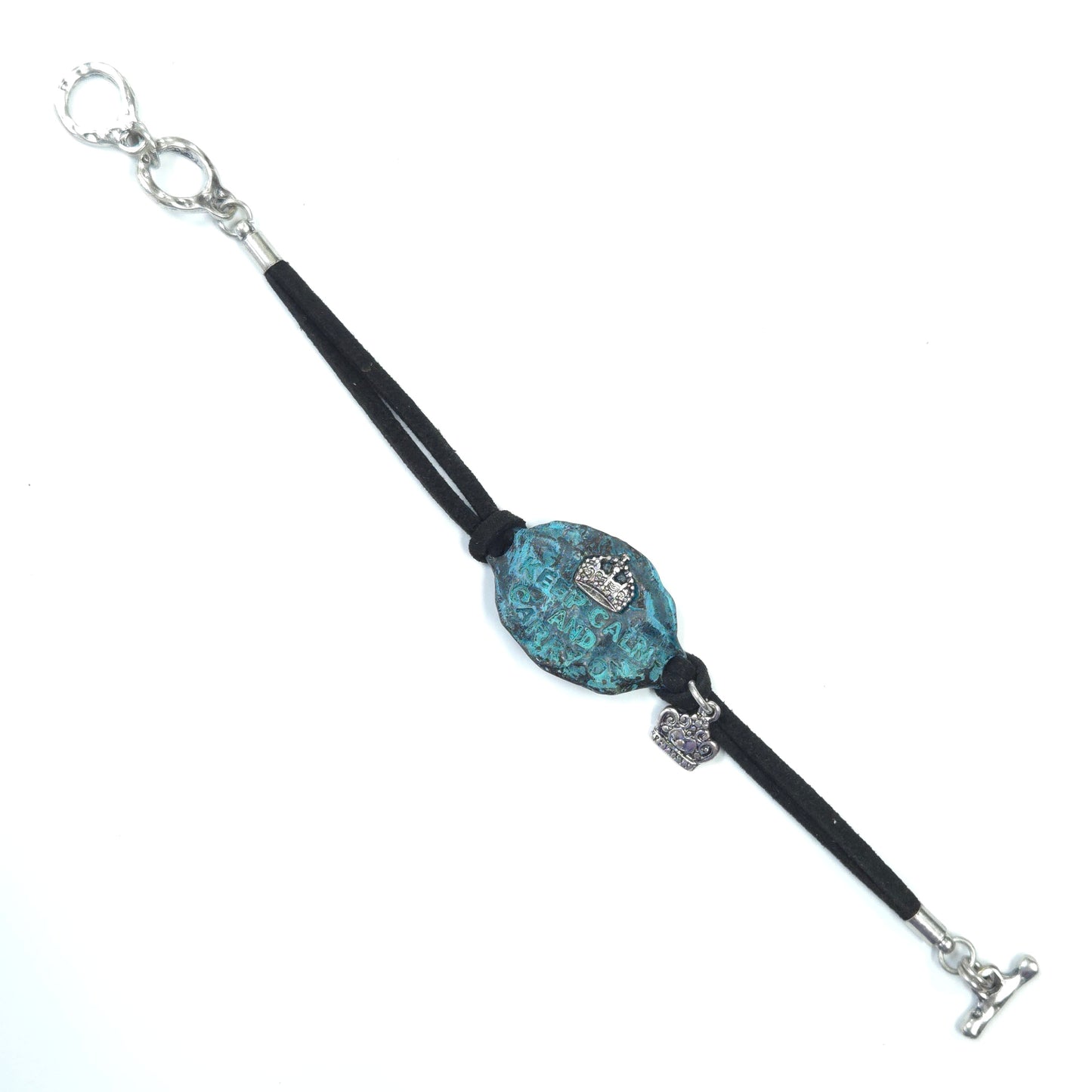 Bracelet with a blue textured bead and silver clasp on a white background