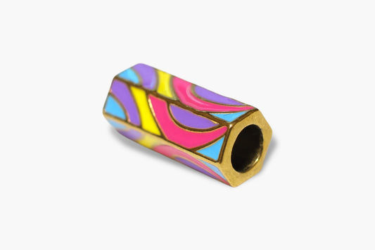 Colorful cylindrical object with a gold rim on a white background