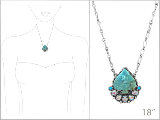 Turquoise pendant necklace with silver chain on a white background