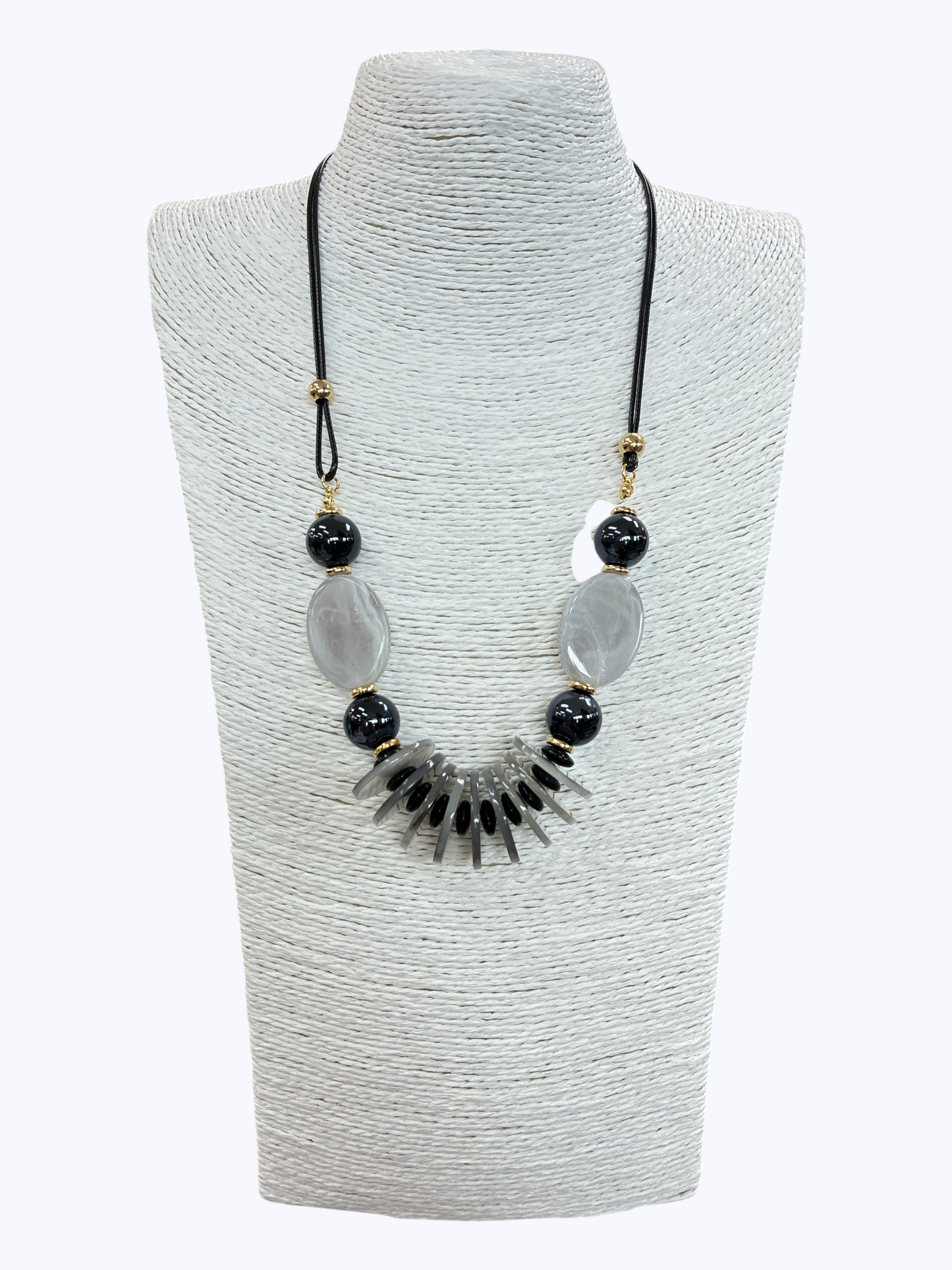 Black and gray statement bead necklace with glossy marbled accents, geometric drop beads, and gold-tone details for a bold boutique-inspired look.