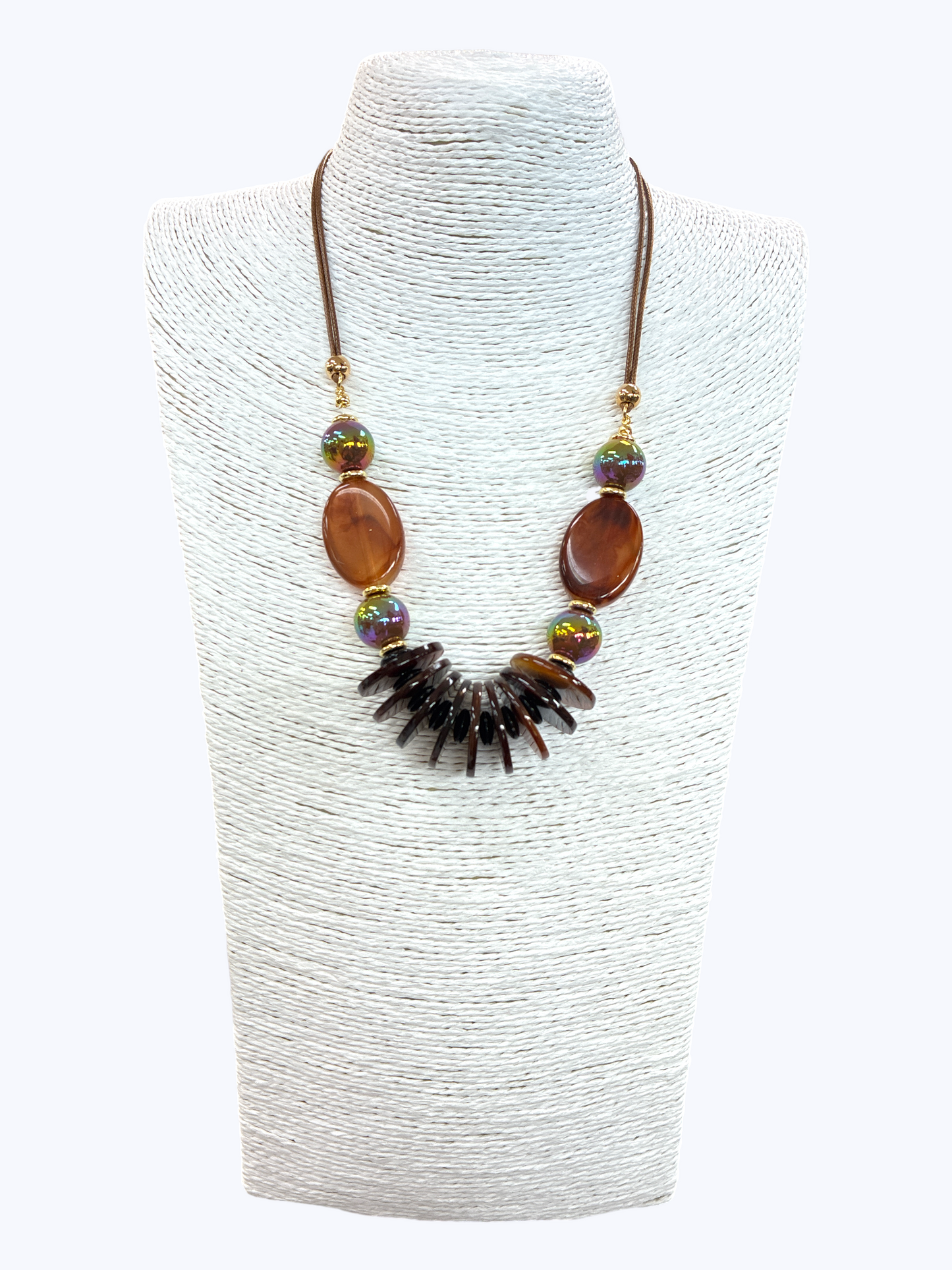 Brown statement bead necklace with marbled oval accents, iridescent beads, and layered drop details for a warm artisan boutique style.