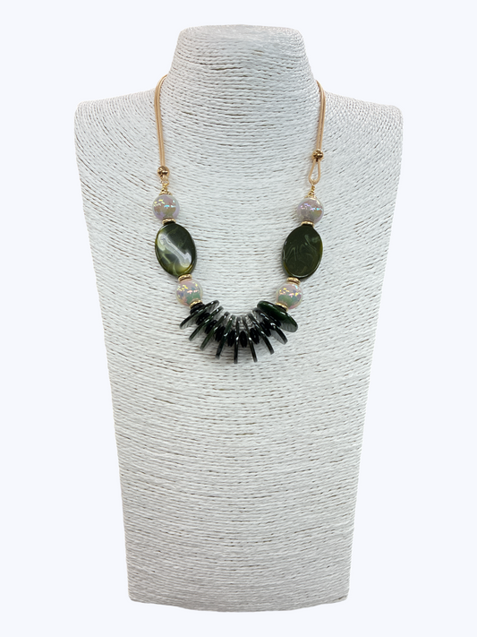 Green marbled statement necklace with glossy oval beads, iridescent accents, and layered drop details for a modern earthy boutique look.