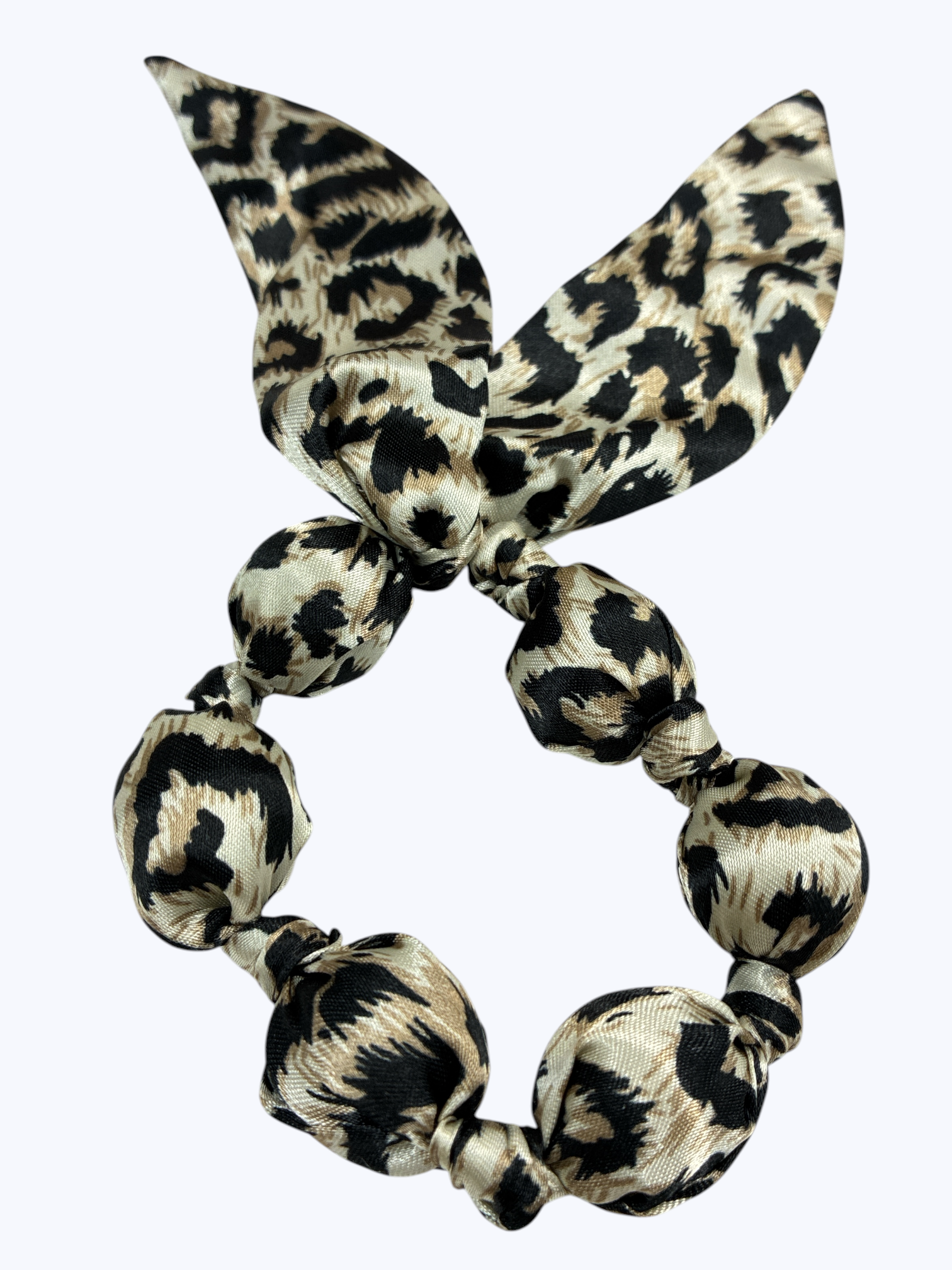 Leopard print hair scrunchie on a white background