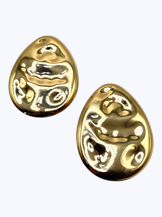 Abstract hammered teardrop stud earrings with sculpted textured metal finish and modern boutique style.