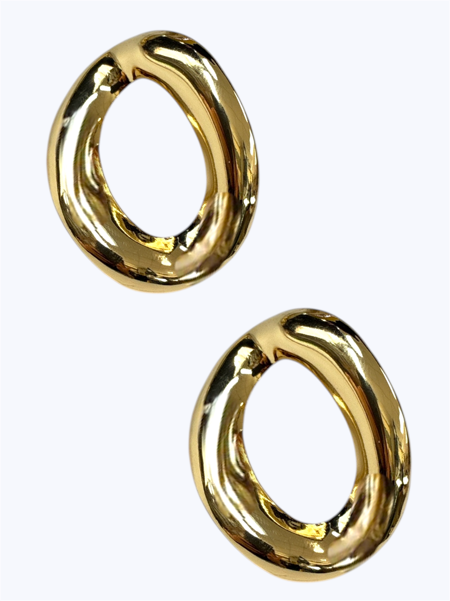 Gold-tone organic oval hoop earrings with polished sculptural design for minimalist modern boutique fashion accessories collection