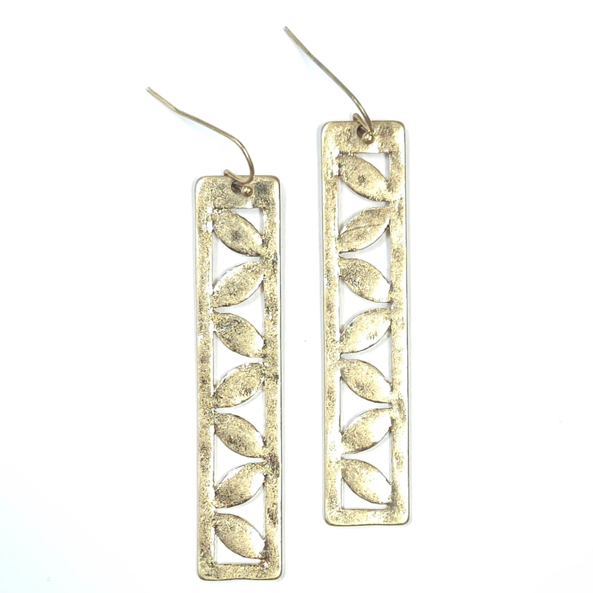 Silver leaf-shaped earrings on a white background