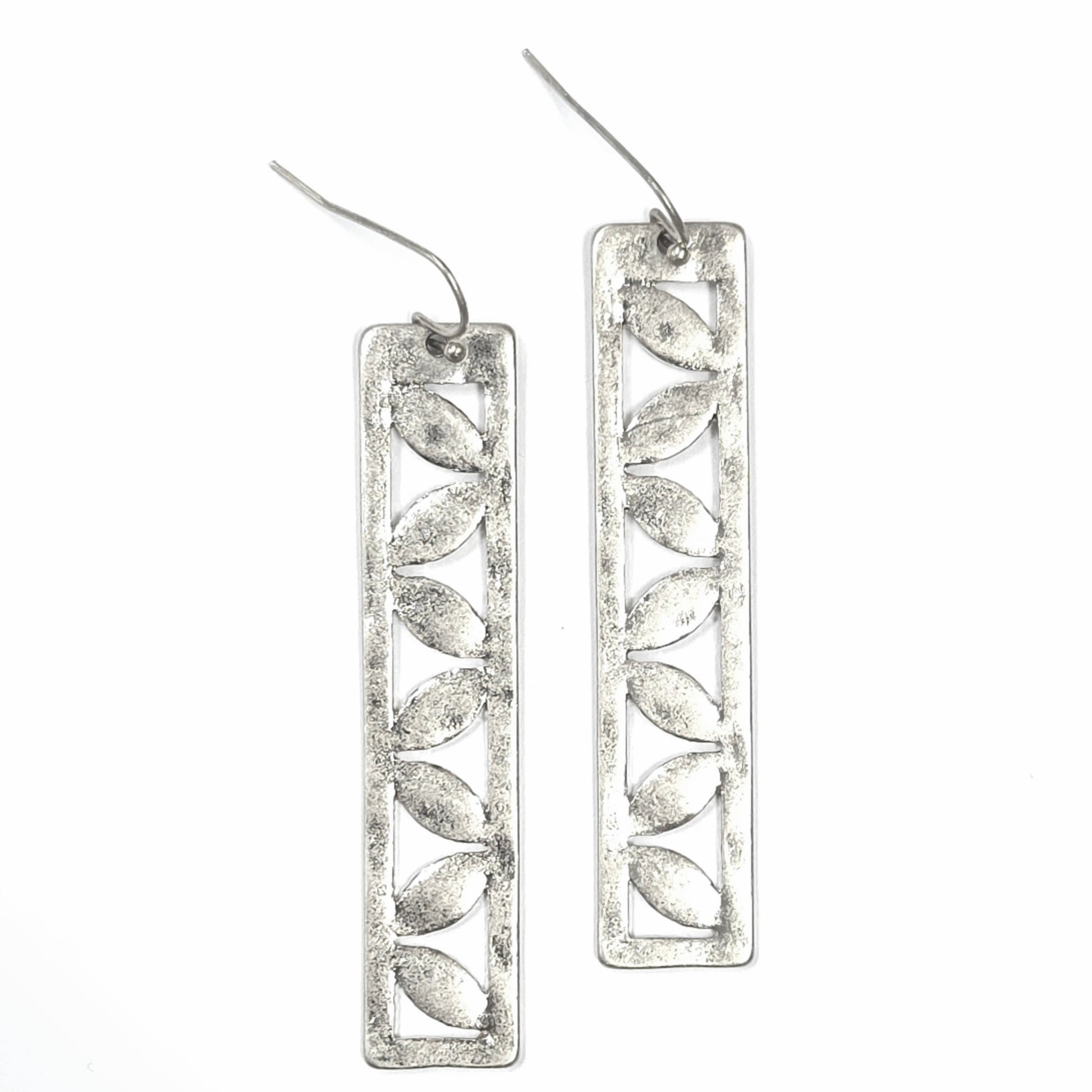 Silver leaf-shaped earrings on a white background