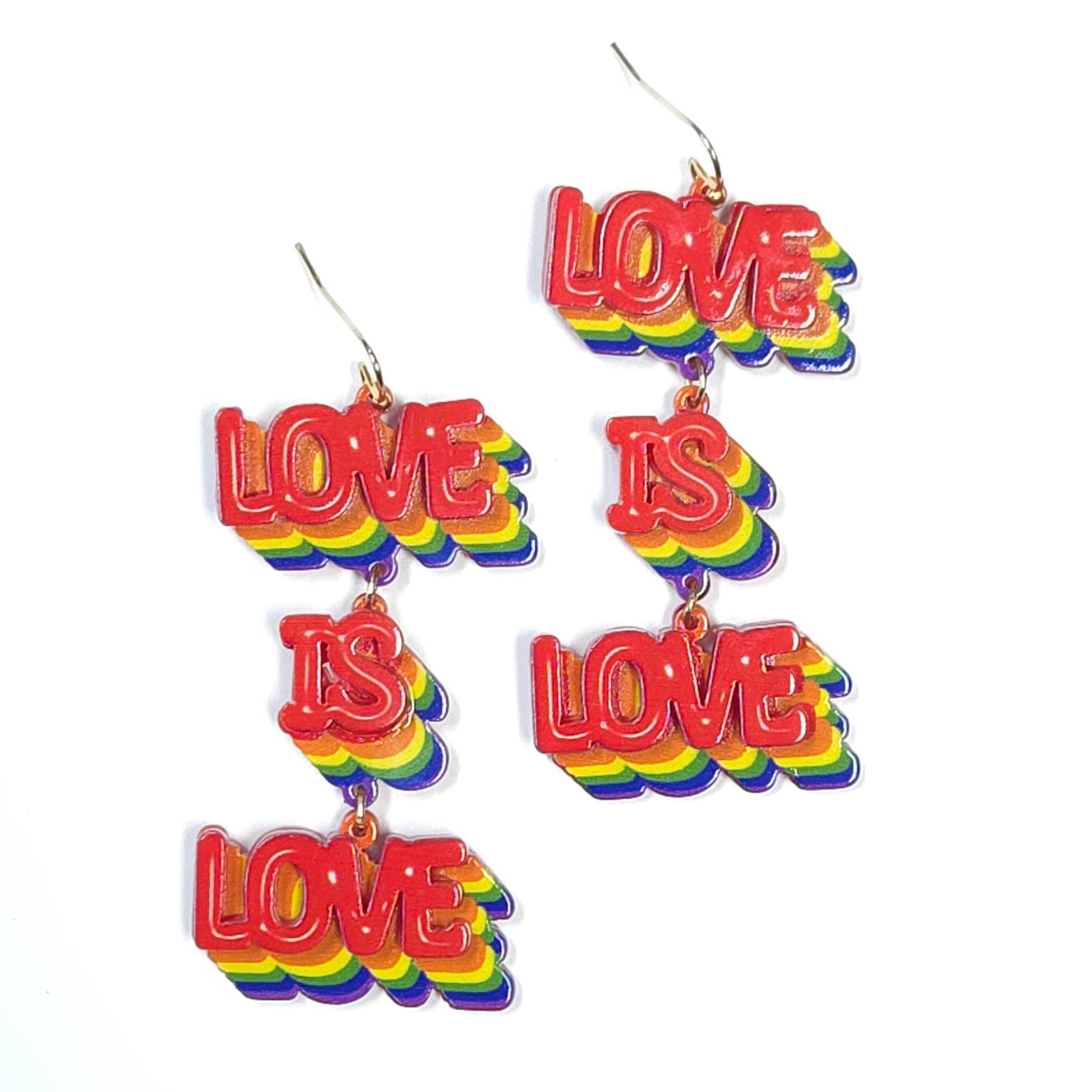 Colorful 'LOVE IS LOVE' earrings on a white background