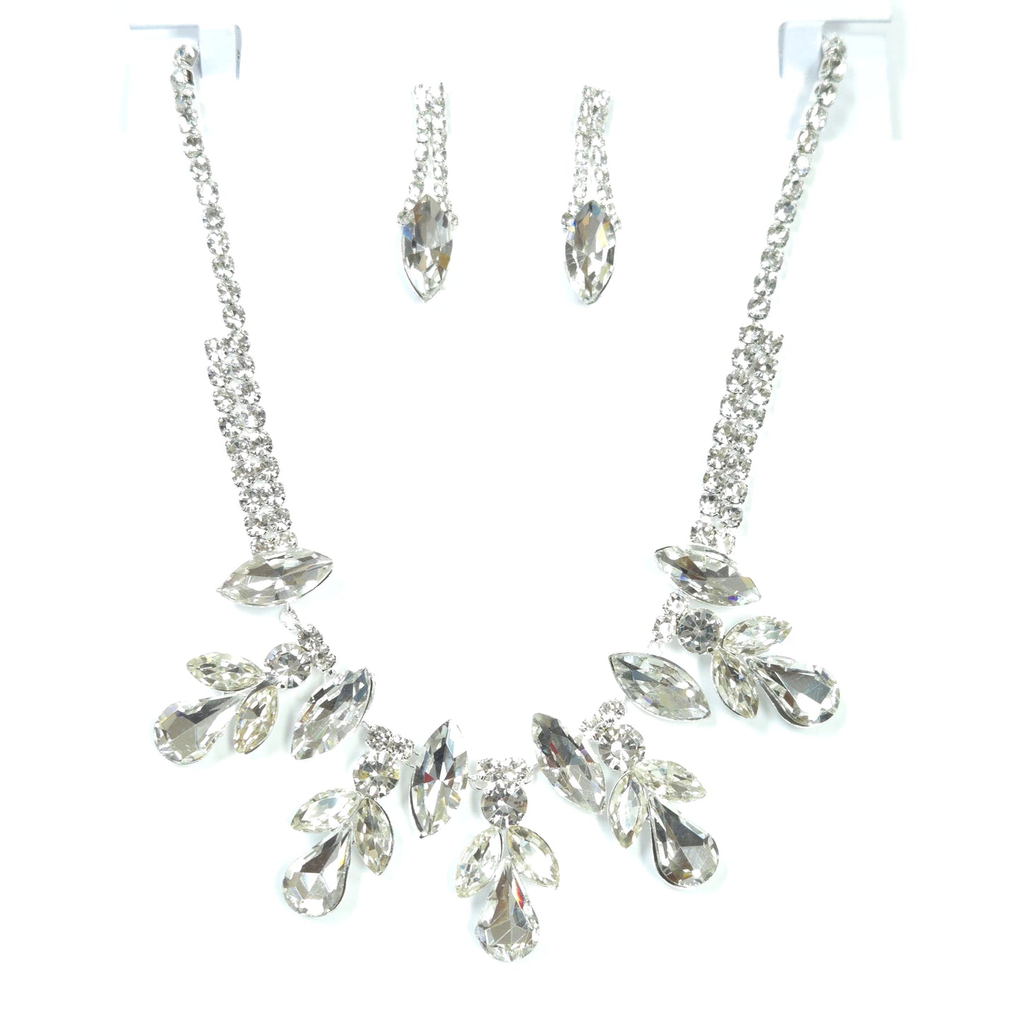 Silver hair accessories with clear crystals on a white background
