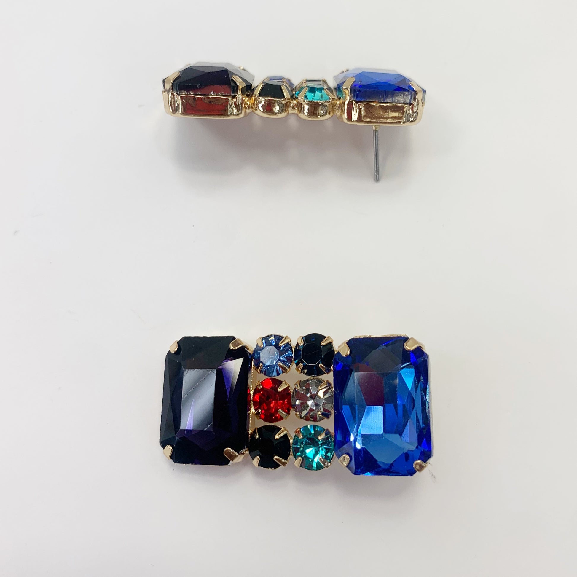 Rectangular crystal drop earrings with multicolor gemstone-inspired accents in a bold glamorous boutique style.