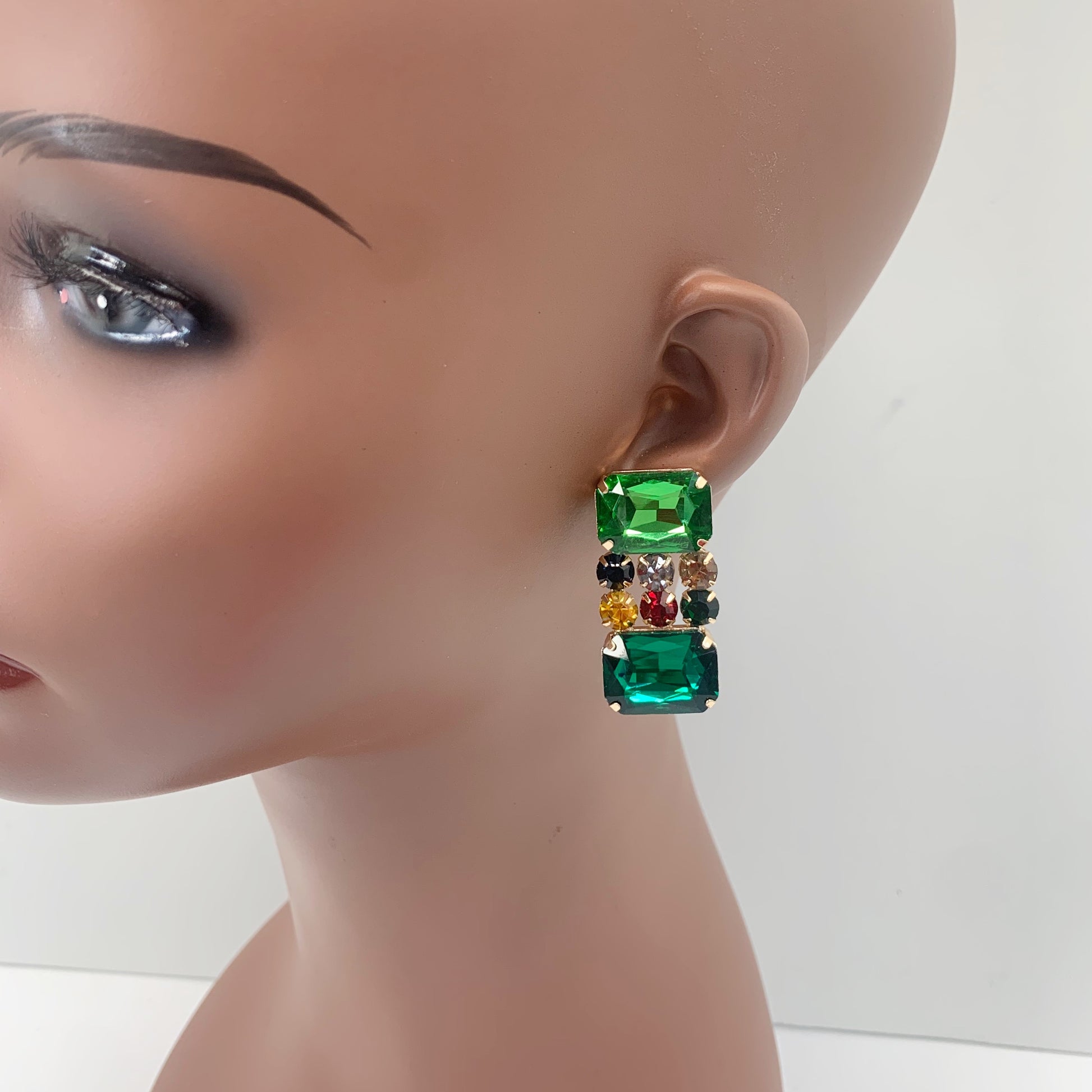 Rectangular crystal drop earrings with multicolor gemstone-inspired accents in a bold glamorous boutique style.