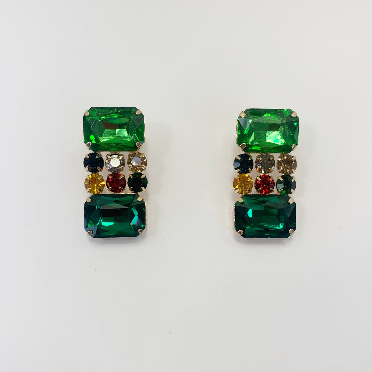 Rectangular crystal drop earrings with multicolor gemstone-inspired accents in a bold glamorous boutique style.