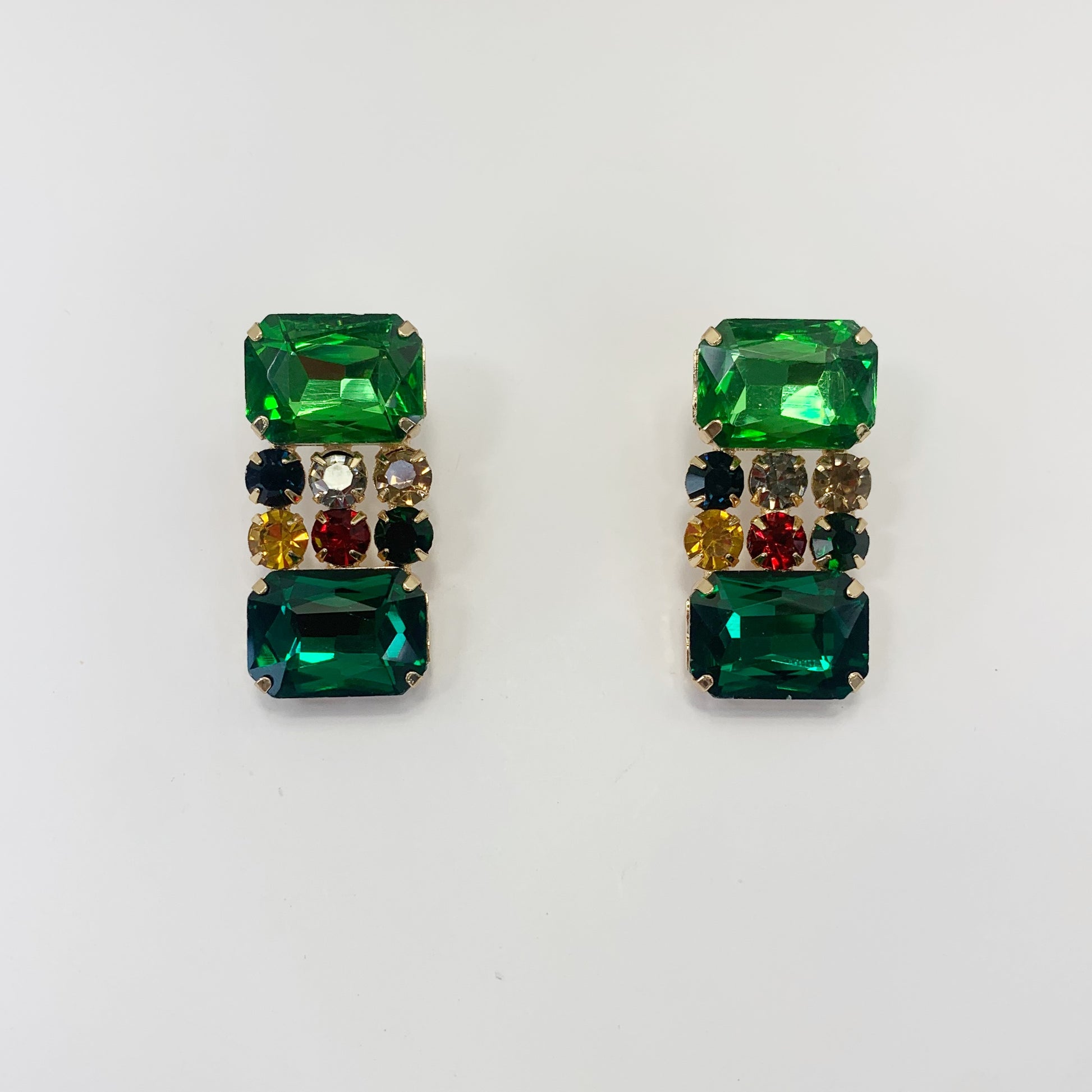 Rectangular crystal drop earrings with multicolor gemstone-inspired accents in a bold glamorous boutique style.