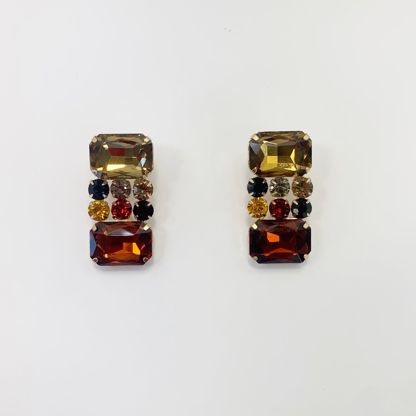 Rectangular crystal drop earrings with multicolor gemstone-inspired accents in a bold glamorous boutique style.