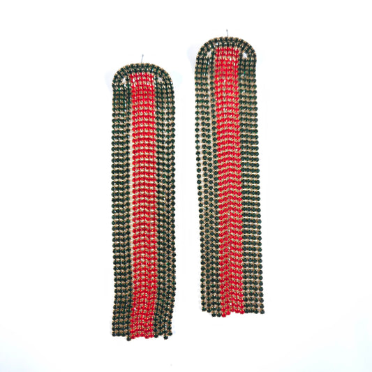 Pair of long, rectangular earrings with red and green striped pattern on a white background