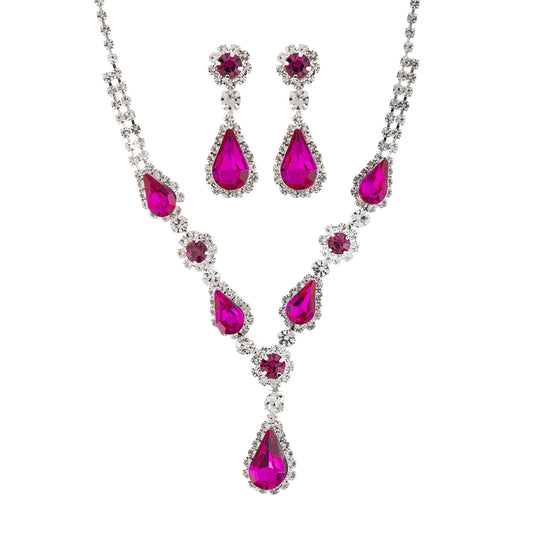 Jewelry set with pink teardrop-shaped stones on a white background