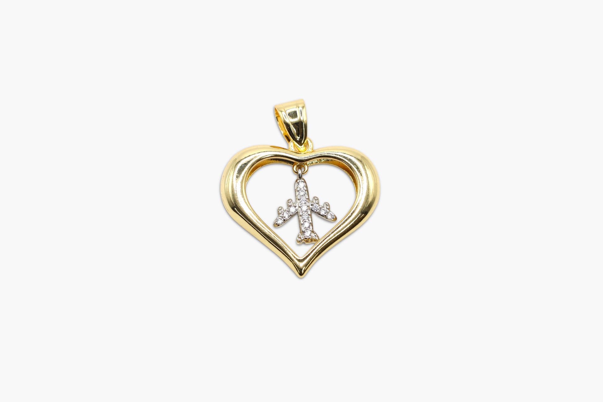 Gold heart-shaped pendant with a cross design on a white background