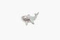 Pearl whale brooch on a white background