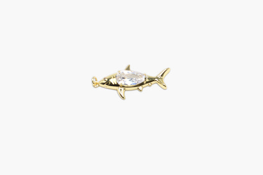 Gold fish-shaped earring with a clear gemstone on a white background
