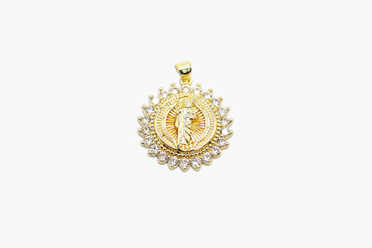 Gold pendant with intricate design on a white background