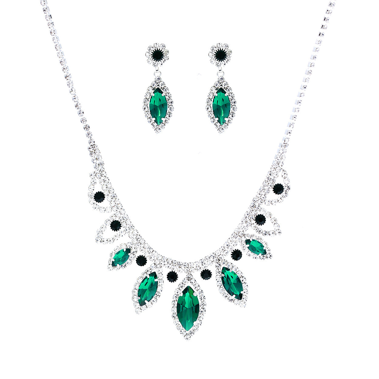 Jewelry set with emerald green gemstones on a white background