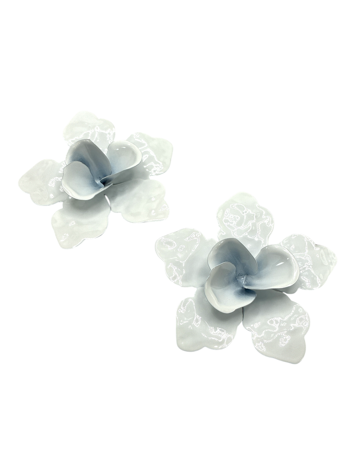 Glossy light blue flower stud earrings with sculpted petal design, playful feminine statement jewelry, lightweight floral fashion accessory.