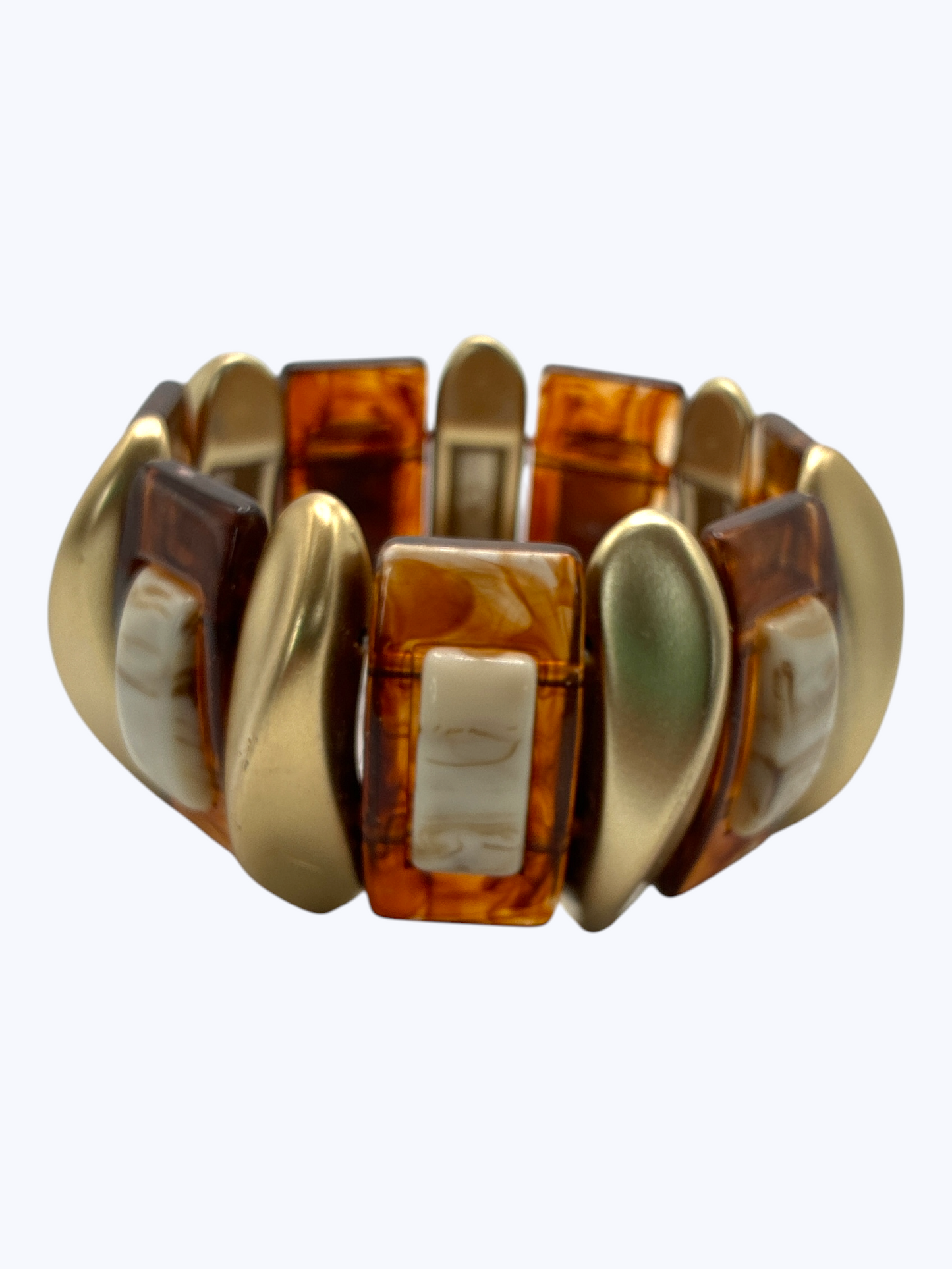 Chunky stretch bracelet with marbled amber resin links, gold-tone accents, and geometric details for a bold boutique-inspired statement look.