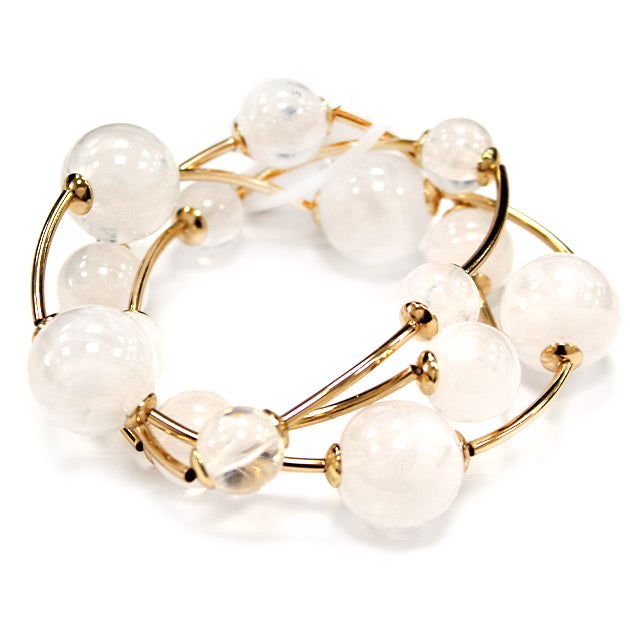 Multi strand acrylic bead coil bracelet with glossy round beads and gold wire accents in white