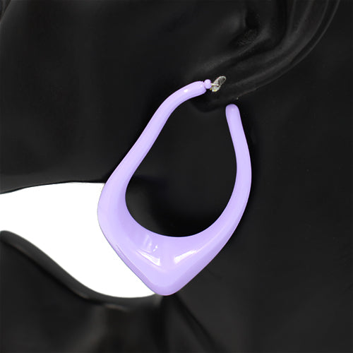 Oversized sculptural hoop earrings with abstract curved teardrop shape and glossy finish