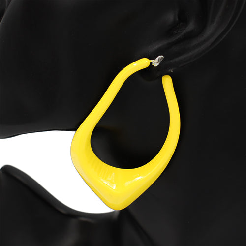 Oversized sculptural hoop earrings with abstract curved teardrop shape and glossy finish