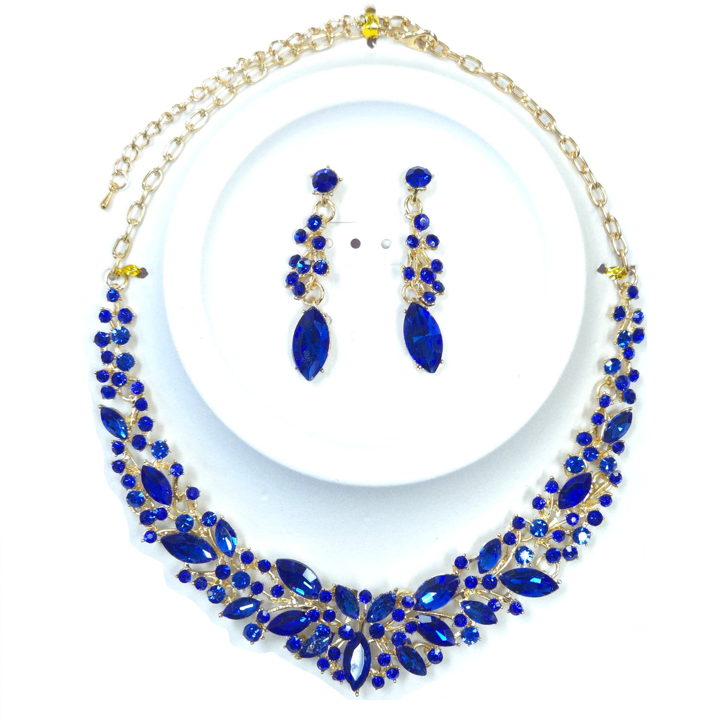 Blue gemstone necklace and earrings set on a white background