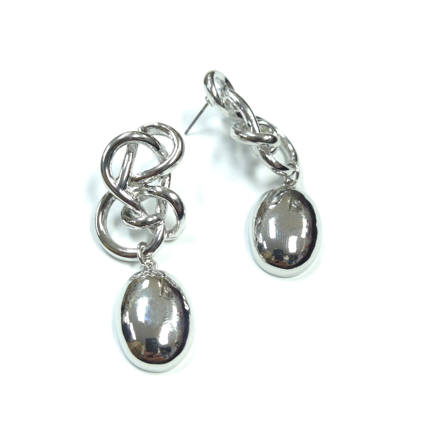 Pair of silver earrings with circular and interlocking design on a white background