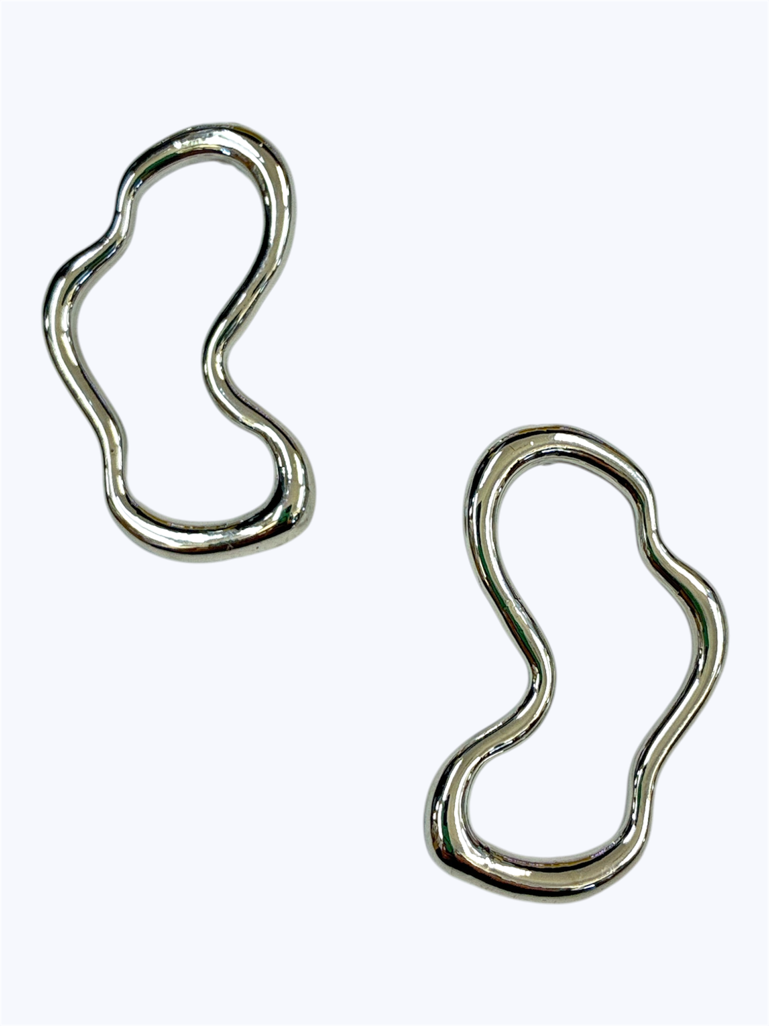 Organic shape stud earrings with an abstract open-frame silhouette and polished finish in a modern minimalist style.