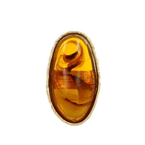 Oversized oval resin cocktail ring with abstract swirl detailing and textured metallic trim.