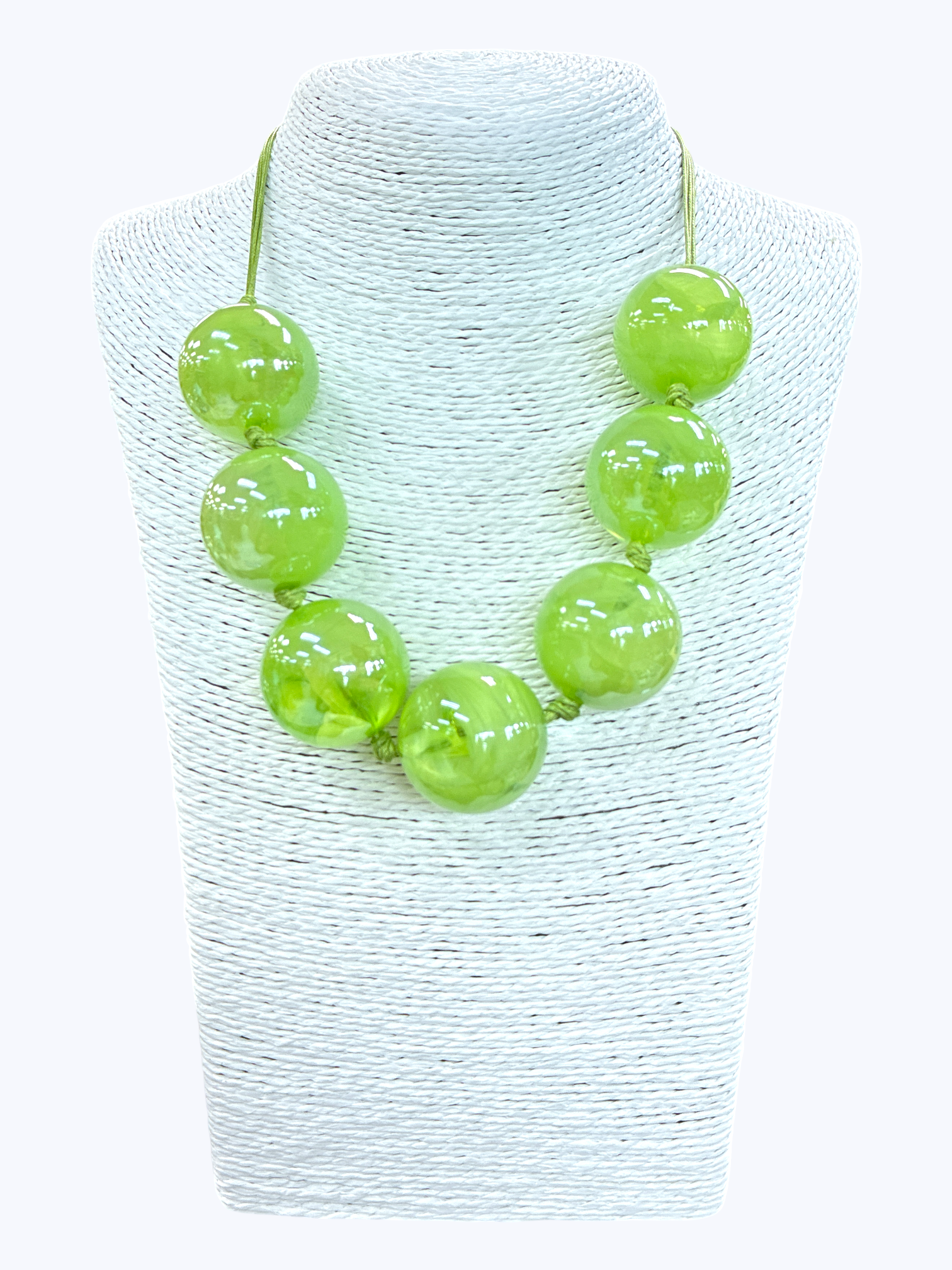 Lime green chunky bead statement necklace with glossy oversized beads and minimalist cord design displayed on mannequin bust