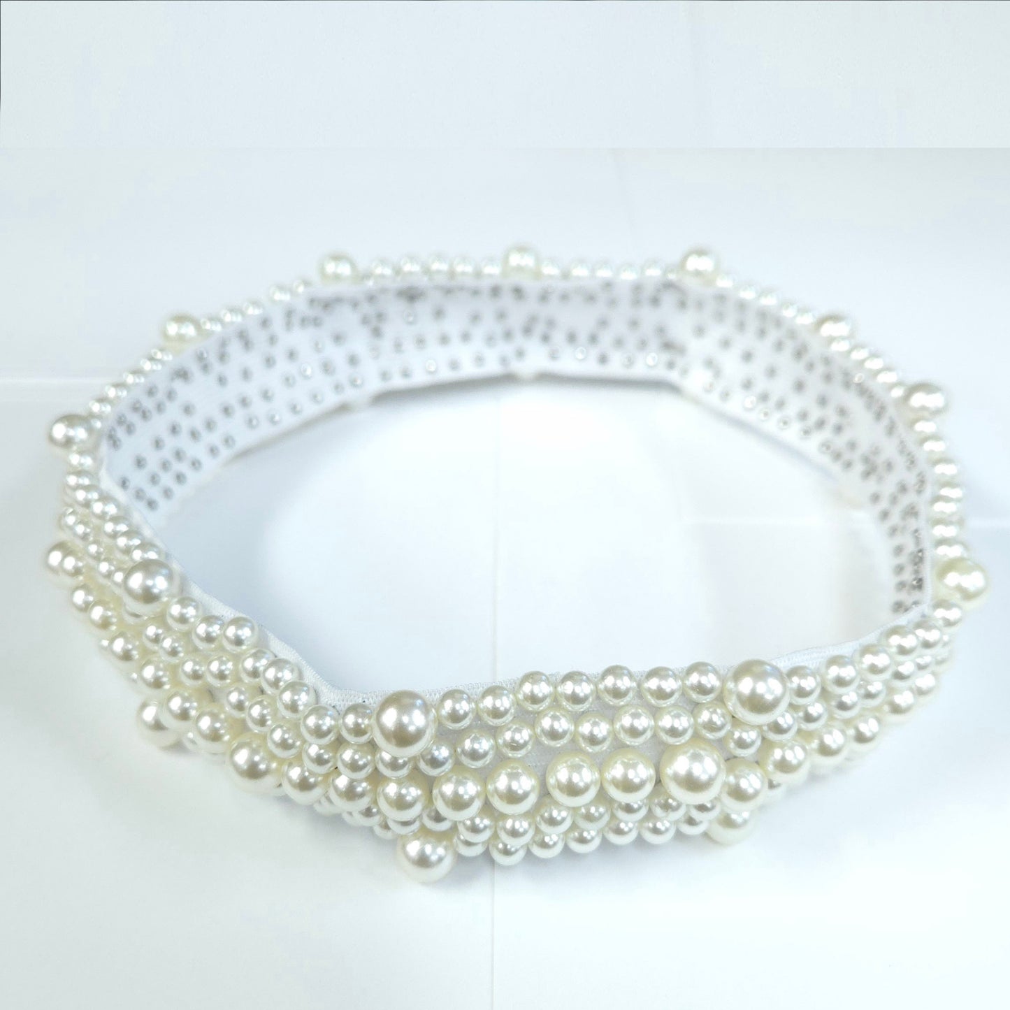 Pearl necklace on a white background