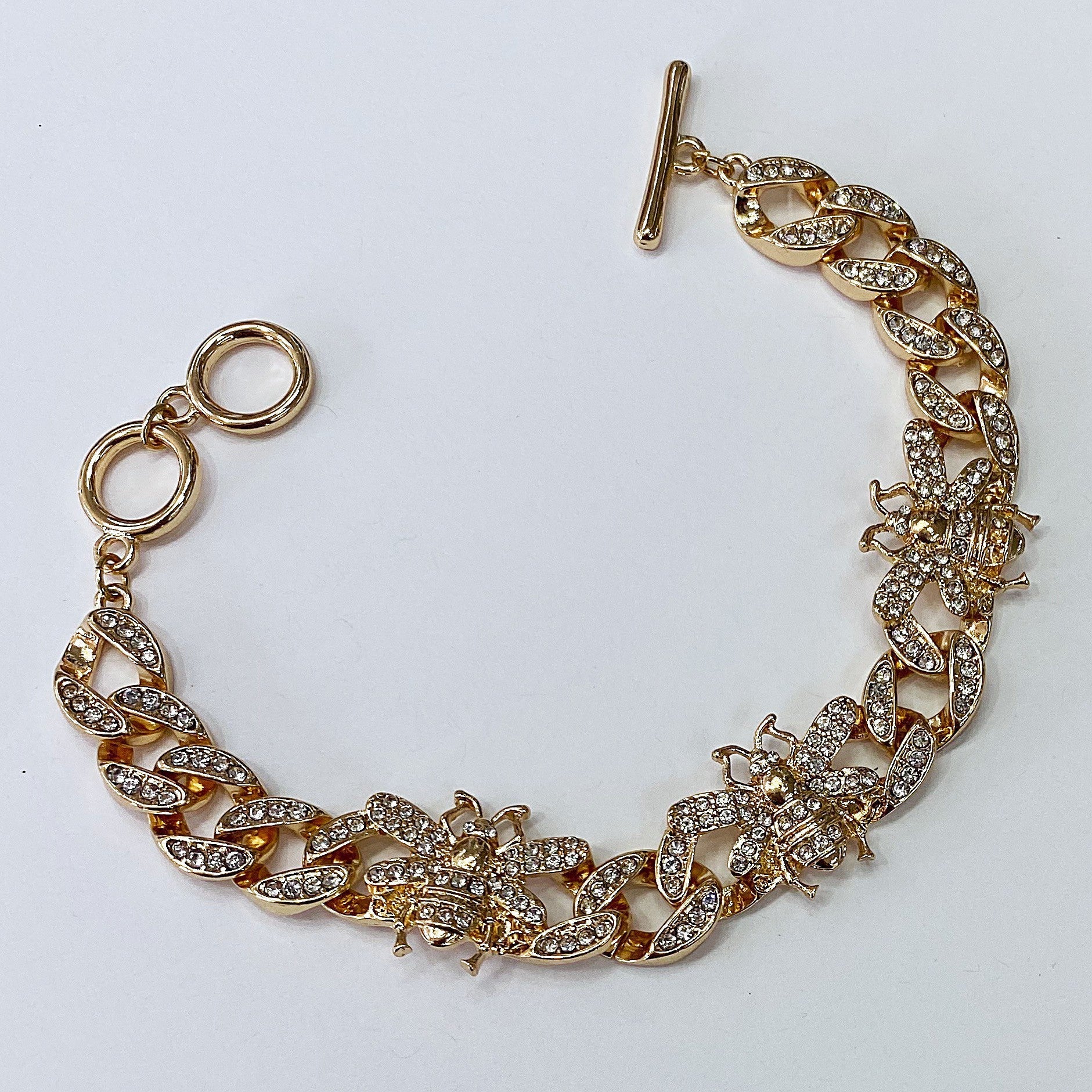 Chunky chain bracelet featuring crystal bee motifs, pavé links, and toggle clasp closure