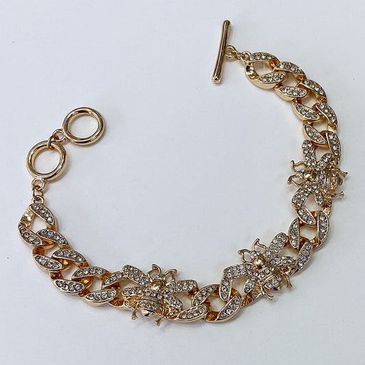Chunky chain bracelet featuring crystal bee motifs, pavé links, and toggle clasp closure