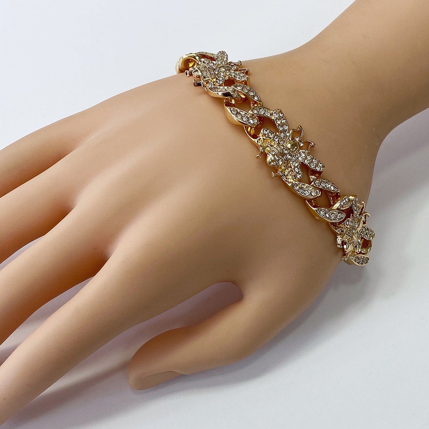Chunky chain bracelet featuring crystal bee motifs, pavé links, and toggle clasp closure