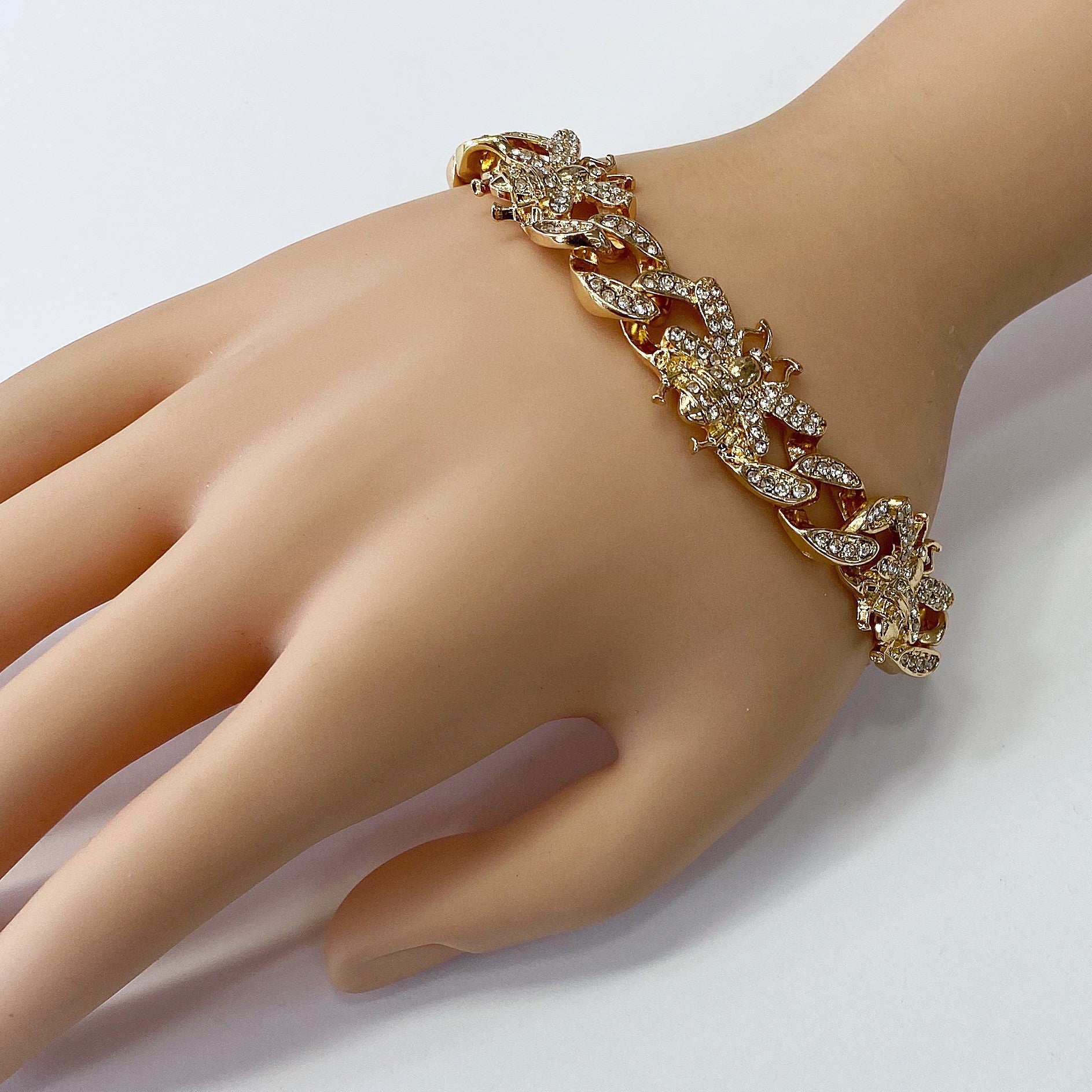 Chunky chain bracelet featuring crystal bee motifs, pavé links, and toggle clasp closure