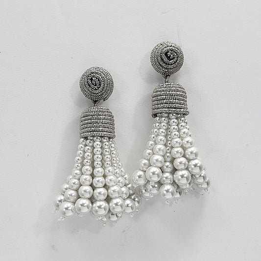 A pair of silver and white pearl tassel drop dangle post earrings.