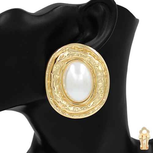 Gold earring with a pearl-like center on a black mannequin head.