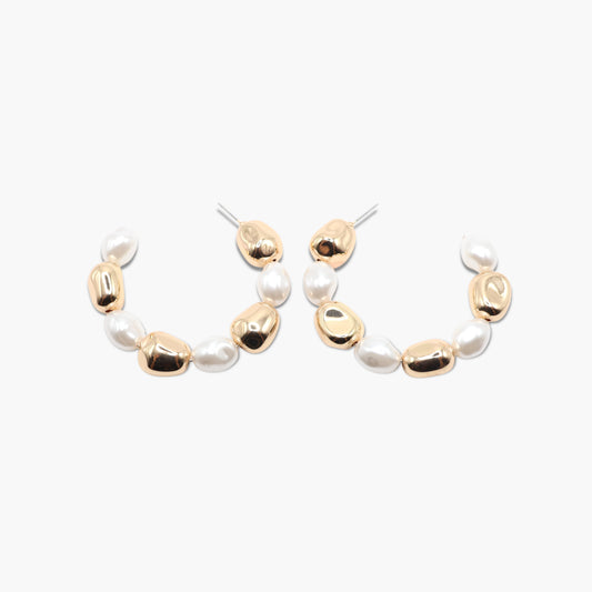 A pair of gold-colored hoop earrings with white pearl accents.