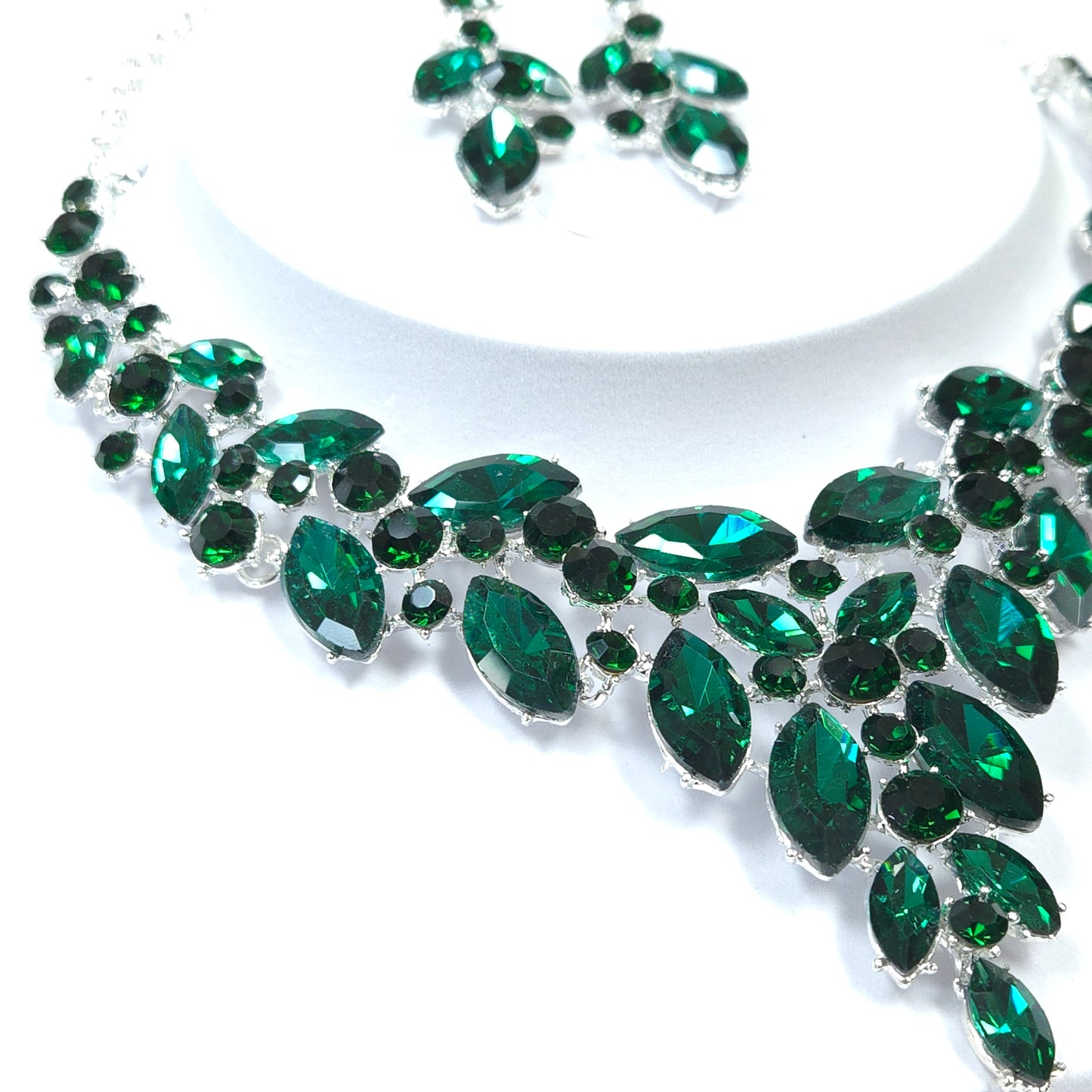 Green gemstone embellishment on a white background