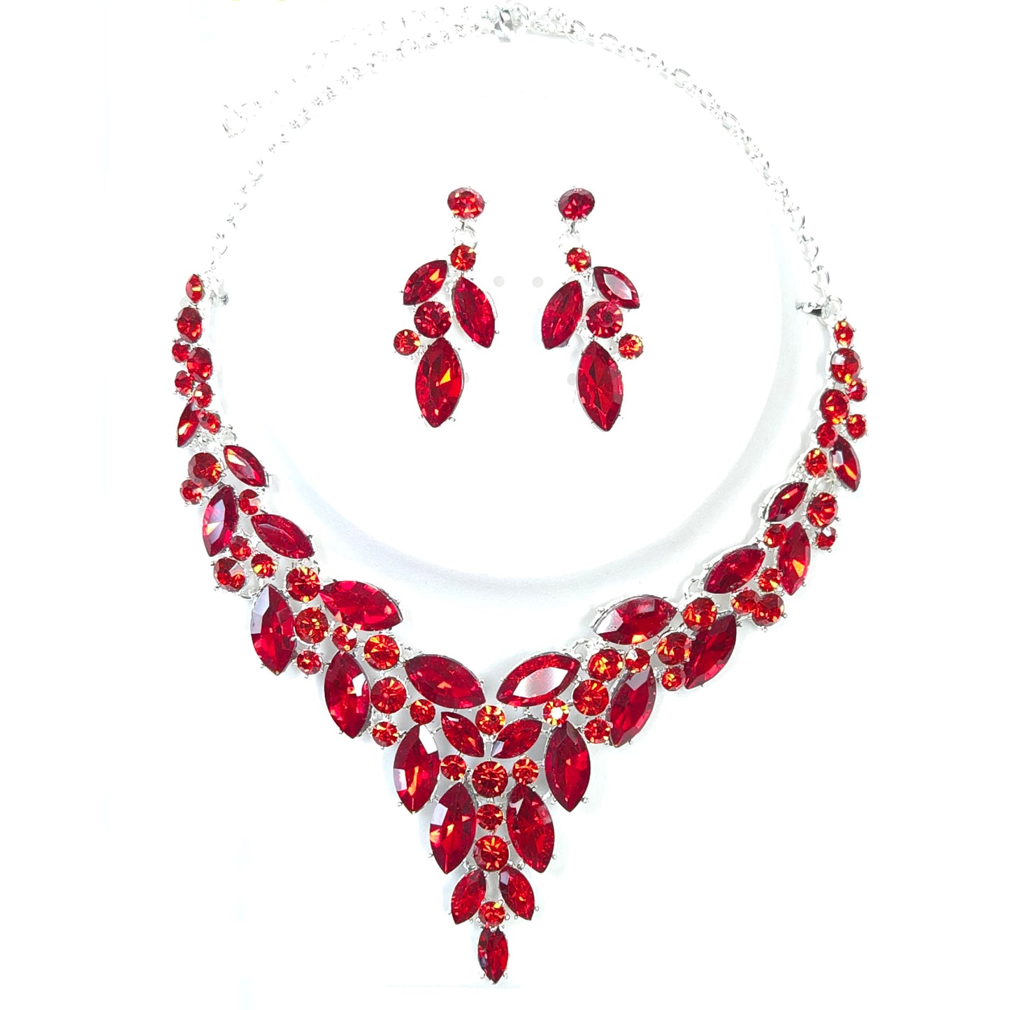 Red gemstone necklace and earrings set on a white background